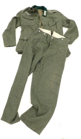 A film prop woolen jacket and trousers, from Band of Brothers, marked Wardrobe Issued and numbered 0049/7472/1608, the hanger marked East Wing 305, in green.