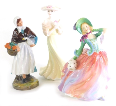 A Royal Doulton figure Autumn Breezes, HN1911, printed marks beneath, 19cm high, and two other figures, Coalport, etc. (3)