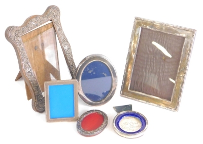 A George V silver photograph frame, with rectangular glass and oak easel back, Birmingham probably 1920, 18cm x 12cm, five various photograph frames, silver fronted, oak example, etc. (a quantity)