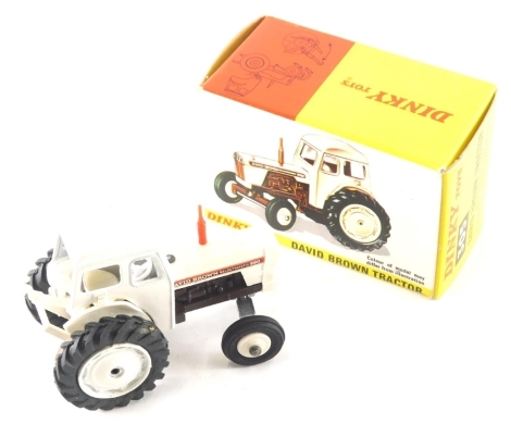 A Dinky Toys diecast David Brown tractor, in white and brown, number 305, 7cm high. (boxed)