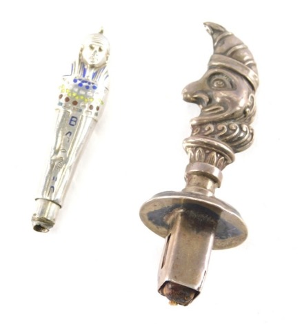 An Edward VII silver Mr Punch bottle stopper, repousse decorated, Birmingham 1908, 6cm high, together with a Mummy shaped top inset with small coloured sections. (2)