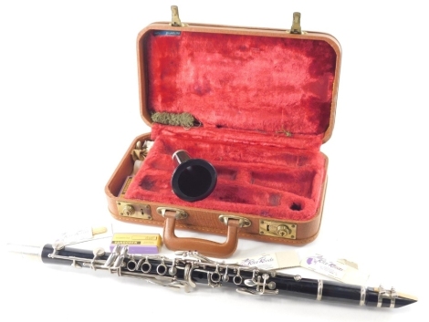 A 20thC Boosey & Hawkes clarinet, in fitted case, 37cm wide.