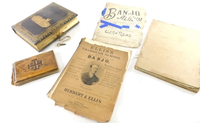 An early 20thC book of pressed flowers, to include Jordan and Jericho, etc., a Balmoral photograph album and an Ellis banjo sheet music book. (a quantity)