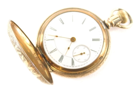 An early 20thC gold plated hunter pocket watch, the pierced case with 4cm diameter Roman numeric dial with subsidiary second hand marked Flower City Watch Co, numbered 912118.