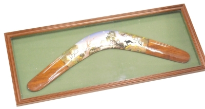 20thC Aboriginal School. Boomerang painted with a kangaroo in silhouette, framed, 22cm x 54cm.