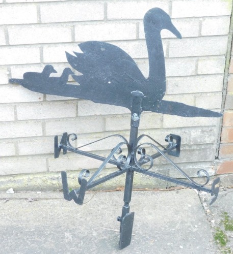 A wrought iron weather vain, decorated with swan and signets.