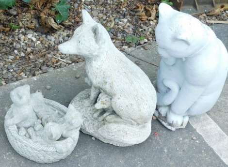 Three composition garden ornaments, one in the form of a cat and kittens and a fox etc.