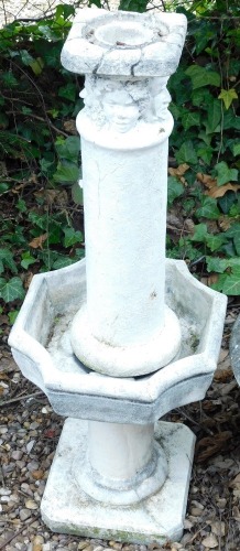 A garden fountain, the column top, decorated with masks, etc., the square base, with a cylindrical column, etc., 104cm high overall.