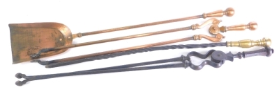 A pair of copper fire tools, and two similar wrought iron and brass fire tools, to include tongs and shovels.