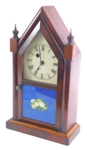 A 19thC Waterbury Clock Company American mantel clock, with an arched case, painted dial, etc., 38cm high.