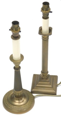 A pair of brass column candlestick lamps, each with square bases with modern electrical fittings,43cm high. (2)