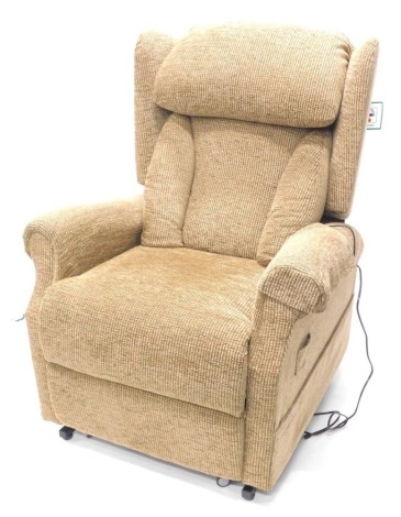 An electric raise and fall CosiChairs reclining armchair, with tweed type fabric, original cost £1,971..