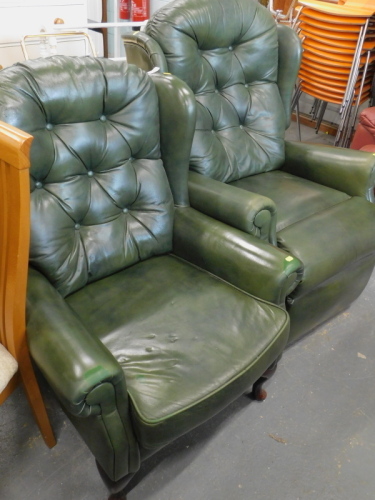 A green leatherette upholstered wing back chair with button back on cabriole legs and a matching reclining chair. The upholstery in this lot does not comply with the 1988 (Fire & Fire Furnishing) Regulations, unless sold to a known exporter or upholsterer