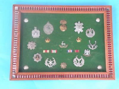 A quantity of gilt metal and base metal cap badges to include the Royal