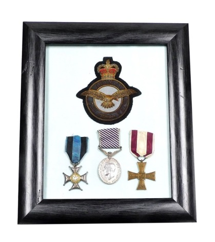 A World War II RAF medal group, named to Sgt. Albin Socha, Polish 300 Squadron, comprising the George VI Distinguished Flying Medal, no 780353, Polish War Order of Virtuti Militari, and Cross of Valour, together with a Royal Air Force fabric badge, frame