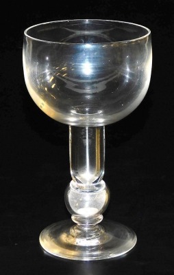 An 18thC glass rummer, with bucket shaped bowl and knopped stem, inset with a silver 3d coin for 1762, 17.5cm high.