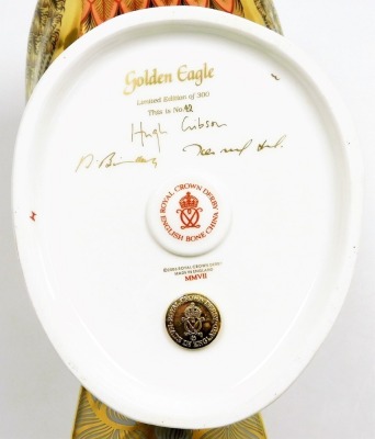 A Royal Crown Derby porcelain Golden Eagle paperweight, modelled by Donald Brindley and decorated by Tien Manh Tinh, limited edition no. 32/300, gold stopper, 23cm high, boxed with certificate. - 4