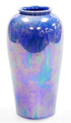 A Ruskin pottery purple lustre vase, of cylindrical form, pattern number 1925, 22cm high.