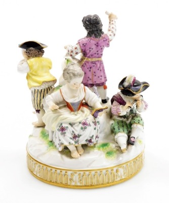 A late 19thC Meissen porcelain figure group, modelled as five children playing instruments and singing, and with a small dog seated at their feet, on a moulded circular base, in polychrome enamels, under glazed blue cross swords mark, 17cm high. (AF) - 3