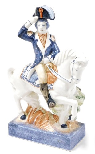 A Rye pottery figure of a gentleman on horseback, in military dress, 32cm high.