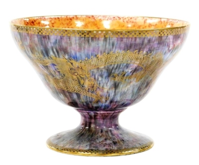 A Wedgwood lustre celestial dragon pedestal bowl, with an orange interior, purple and blue mottled ground, 14cm high, 20cm diameter.