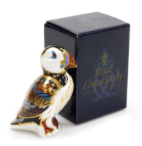 A Royal Crown Derby porcelain Puffin paperweight, gold stopper and red printed marks, 12cm high, boxed.