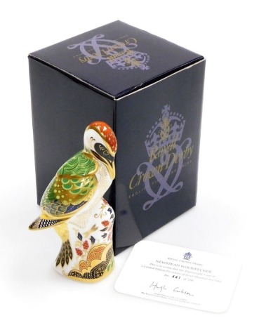 A Royal Crown Derby porcelain Newstead Woodpecker paperweight, designed by Jane James, limited edition no. 441/750, gold stopper and gold printed marks, 16cm high, boxed with certificate.