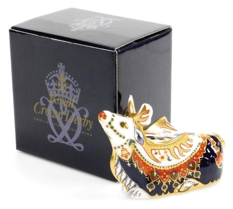 A Royal Crown Derby porcelain Reindeer paperweight, gold stopper and red printed marks, 15cm wide, boxed.