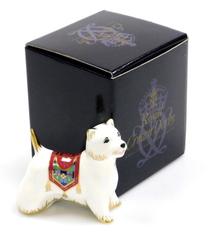 A Royal Crown Derby porcelain West Highland Terrier paperweight, gold stopper and red printed marks, 10cm high, boxed.