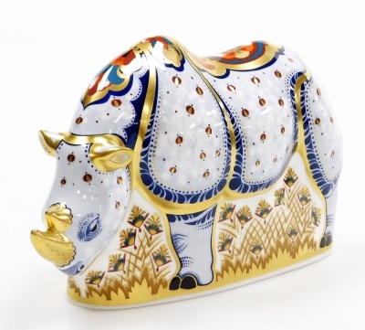 A Royal Crown Derby porcelain White Rhino paperweight, specially commissioned by Sinclairs, signed to base by C Sinclair and Louise Adams, limited edition no. 529/1000, gold stopper and red printed marks, 13cm high, boxed with certificate. - 2