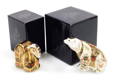 Two Royal Crown Derby porcelain paperweights, comprising Imari Polar Bear, 10cm high and Old Imari Snake, 8cm high, both with gold stoppers and red printed marks, both boxed. (2)
