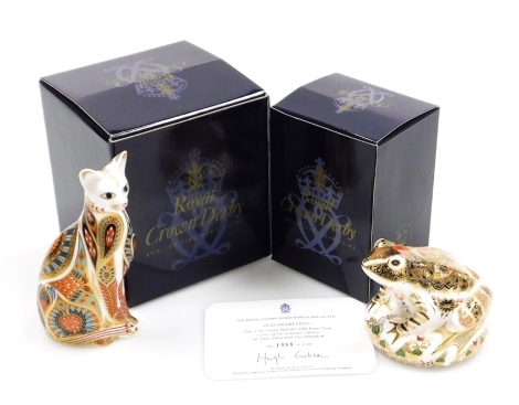 A Royal Crown Derby porcelain Siamese Cat paperweight, gold stopper and red printed marks, 13cm high and Old Imari Frog, designed by John Ablitt, limited edition no. 1481/5000, gold stopper and red printed marks, 8cm high, boxed with certificate.