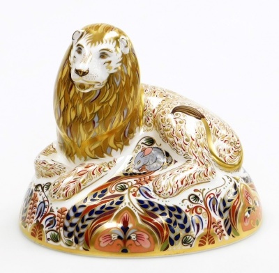 A Royal Crown Derby porcelain Lion paperweight, gold stopper and red printed marks, 16cm high, boxed. - 2