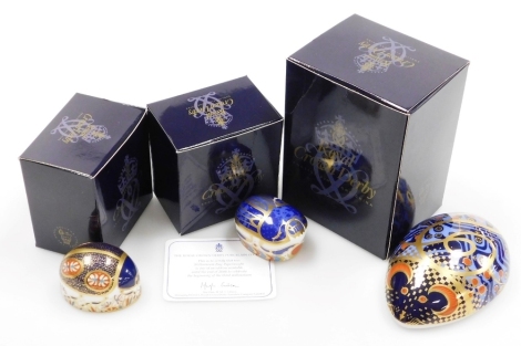 A group of Royal Crown Derby porcelain paperweights, comprising Computer Mouse, gold stopper and red printed marks, 12cm wide, Millennium Bug, gold stopper and red printed marks, 5.5cm diameter, and Blue Ladybird, silver stopper and red printed marks, 5.5