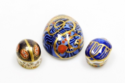 A group of Royal Crown Derby porcelain paperweights, comprising Computer Mouse, gold stopper and red printed marks, 12cm wide, Millennium Bug, gold stopper and red printed marks, 5.5cm diameter, and Blue Ladybird, silver stopper and red printed marks, 5.5 - 3