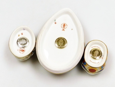 A group of Royal Crown Derby porcelain paperweights, comprising Computer Mouse, gold stopper and red printed marks, 12cm wide, Millennium Bug, gold stopper and red printed marks, 5.5cm diameter, and Blue Ladybird, silver stopper and red printed marks, 5.5 - 4