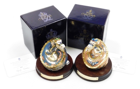 Two Royal Crown Derby porcelain dragon paperweights, Dragon of Happiness and Dragon of Good Fortune, a pair of paperweights to mark the Millennium exclusive to Peter Jones of Wakefield, limited edition no. 627/1500, gold stopper and red printed marks, 11c