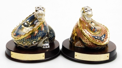 Two Royal Crown Derby porcelain dragon paperweights, Dragon of Happiness and Dragon of Good Fortune, a pair of paperweights to mark the Millennium exclusive to Peter Jones of Wakefield, limited edition no. 627/1500, gold stopper and red printed marks, 11c - 2