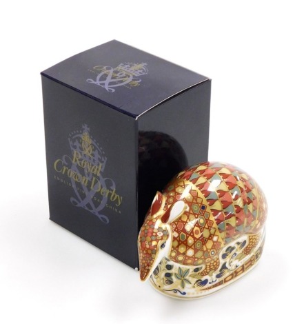 A Royal Crown Derby porcelain Armadillo paperweight, gold stopper and red printed marks, 9cm high, boxed.