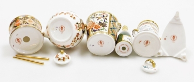 A group of Royal Crown Derby porcelain miniature items, comprising toy drum, 4cm high, miniature champagne bucket and bottle, miniature iron, miniature kettle and tree of life miniature churn. (5) - 4