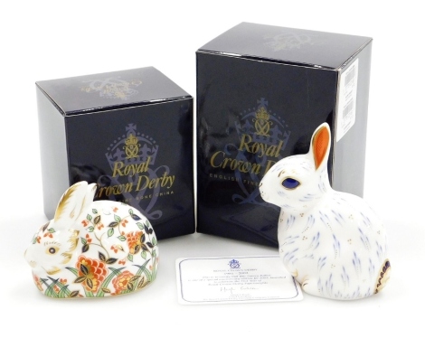 Two Royal Crown Derby porcelain paperweights, comprising Meadow Rabbit, an exclusive for The Royal Crown Derby Collectors Guild, gold stopper and red printed marks, 7cm high, boxed, and Snowy Rabbit, one of a special anniversary edition for 2002 Launch To