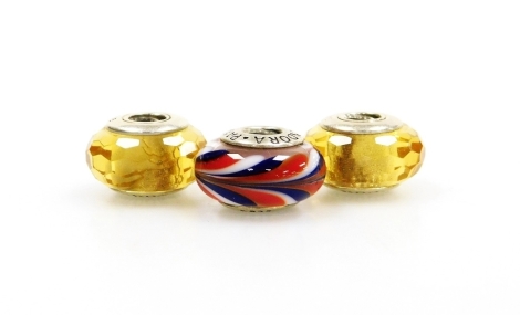 Three Pandora beads, each coloured glass, comprising two citrine coloured and another with red white and blue swirls, each stamped Pandora 925, 11.4g all in. (3)