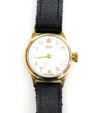 A Tissot 9ct gold lady's wristwatch, with small silvered watch head, in a 9ct gold casing, on a black leather strap, the dial 1.5cm wide, 11.3g all in, boxed.