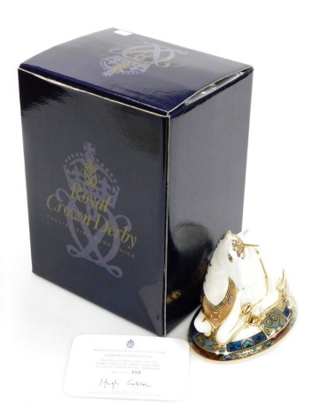 A Royal Crown Derby porcelain Unicorn paperweight, specially designed To Celebrate The New Millennium by Louise Adams, limited edition no. 759/2000, gold stopper with red printed marks, 13cm high, boxed with certificate.