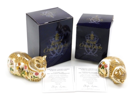 Two Royal Crown Derby porcelain cat paperweights, Clover and Lavender, first in a series of Annual Mother and Young Paperweights, exclusively for Goviers of Sidmouth, designed by Sue Rowe, dated 2002, limited edition no. 888/1500, gold stoppers and red pr