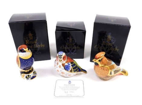 Three Royal Crown Derby porcelain paperweights, comprising Bee Eater, gold stopper and red printed marks, 10cm high, Chelford Chaffinch, gold stopper and red printed marks, 8cm high, boxed with certificate and Wax Wing, gold stopper and red printed marks,