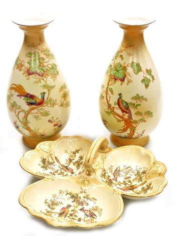 A pair of Crown Ducal Avis pattern blush pottery vases, 33cm high, and a similar Crown Decal blush pottery hors d'oeuvres dish, 31cm wide. (3)