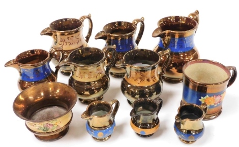 A group of Victorian copper lustre wares, to include graduated set of three jugs, the largest 13.5cm high, three miniature jugs, 6cm high, pedestal bowl, mug, etc. (a quantity)