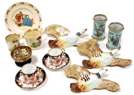 A group of ceramics, to include three graduated Beswick flying Partridge wall plaques, the largest 22cm high, a pair of Copeland porcelain cylindrical vases, decorated with Oriental figures against a turquoise ground, 10cm high, two Royal Crown Derby coff