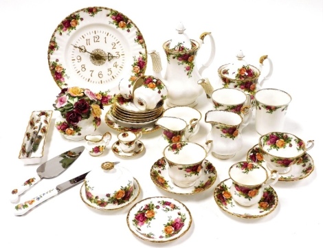 A group of Royal Crown Derby Old Country Roses wares, to include a coffee pot, teapot, sugar bowl, wall clock, cake slice, various teacups and saucers, miniature teacup and saucer, etc. (a quantity)